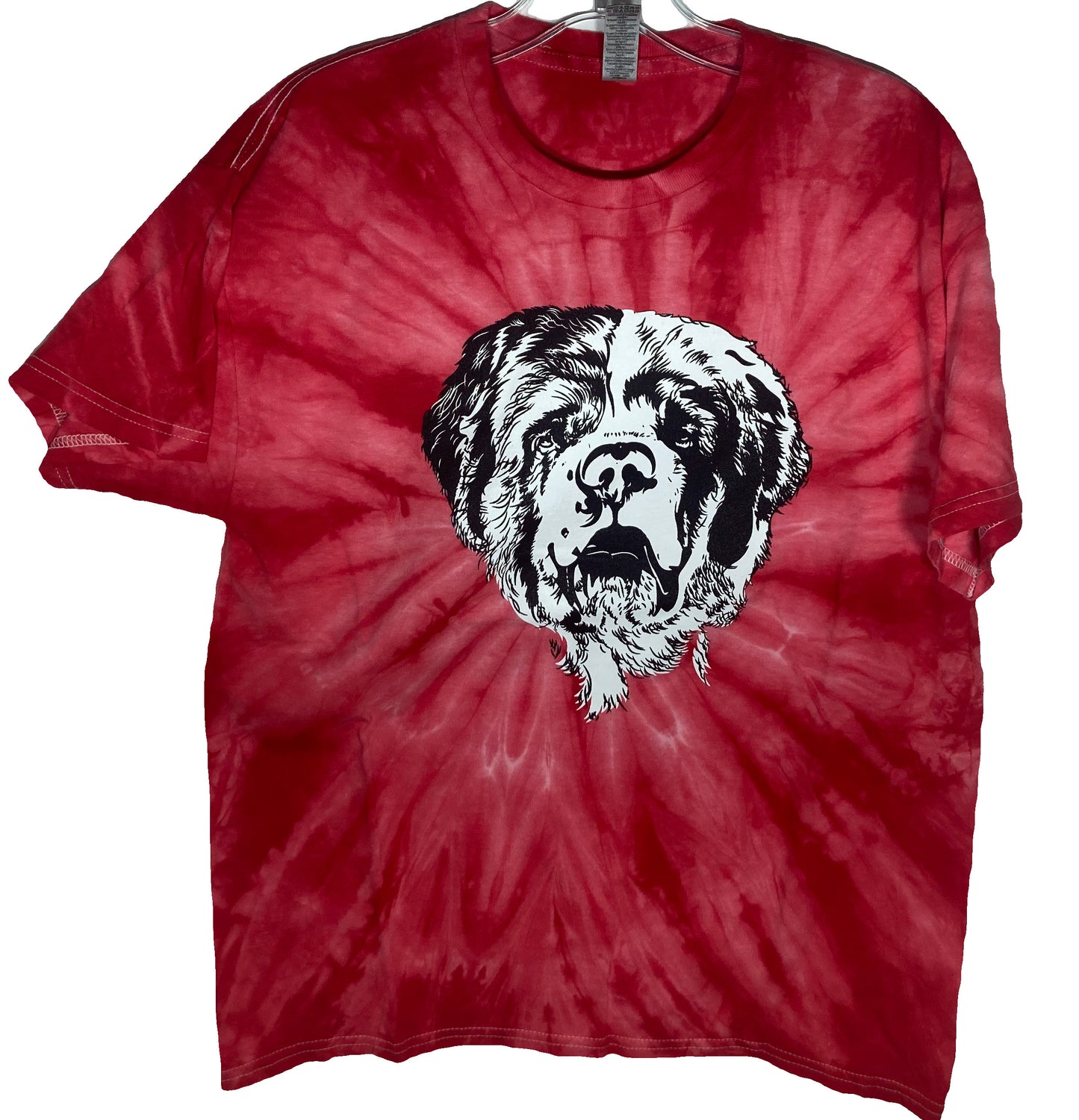 Red tie-dye t-shirt with a large black and white print of a Saint Bernard dog's head on the front, displayed on a hanger.