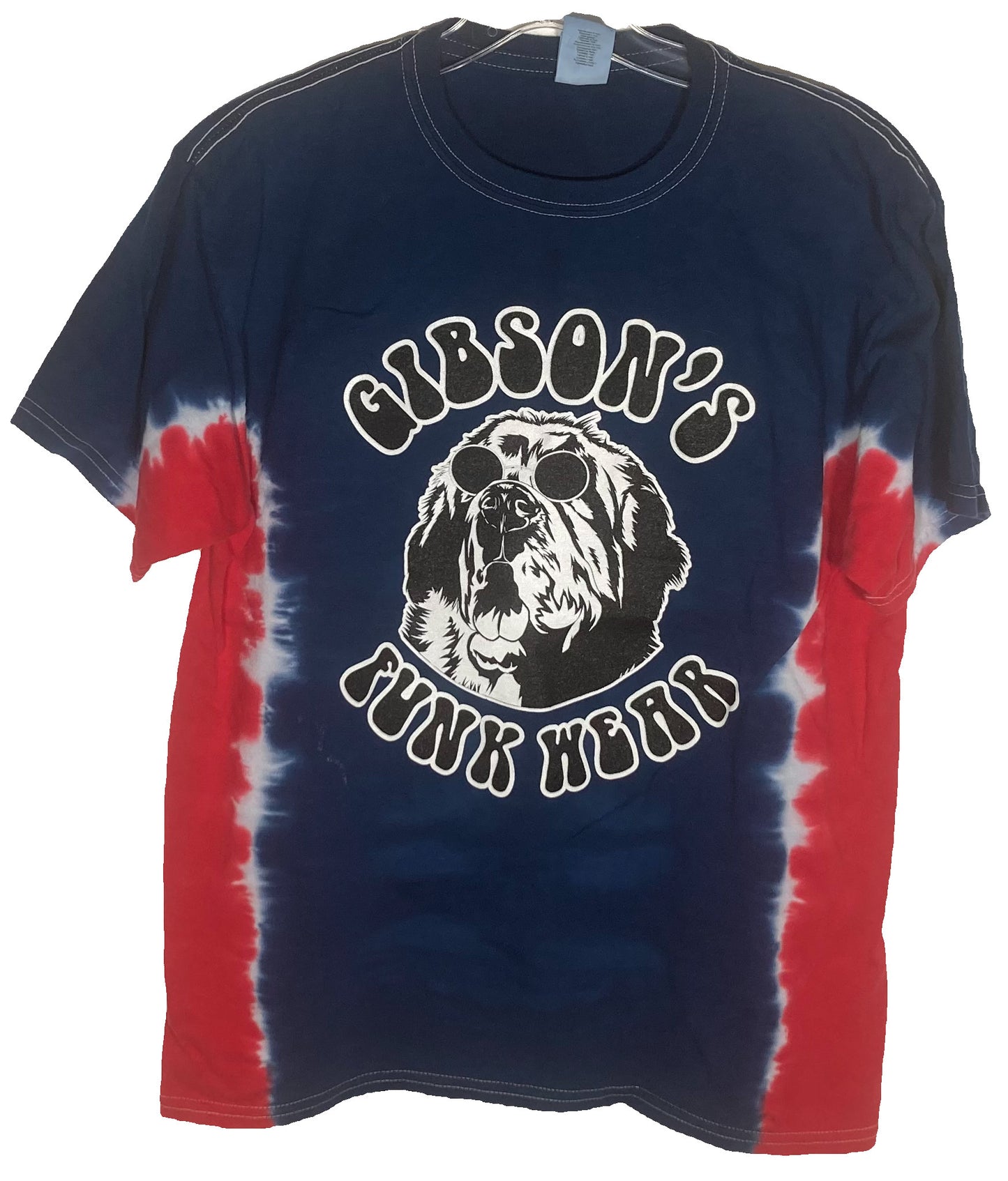 Navy blue Gibson's Funk Wear T-shirt featuring a graphic print of a dog wearing sunglasses and "GIBSON'S FUNK WEAR" white text, with red and white tie-dye accents on the sides.