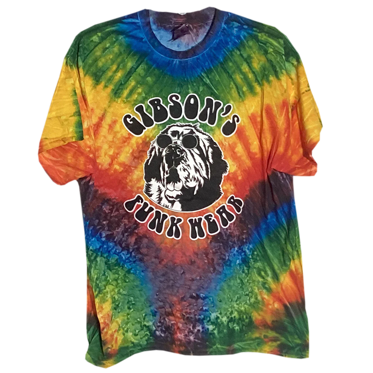 Colorful tie-dye t-shirt featuring a graphic of a dog wearing sunglasses with the text "Gibson's Funk Wear" above and "Junk Wear" below, in a bold, circular design.